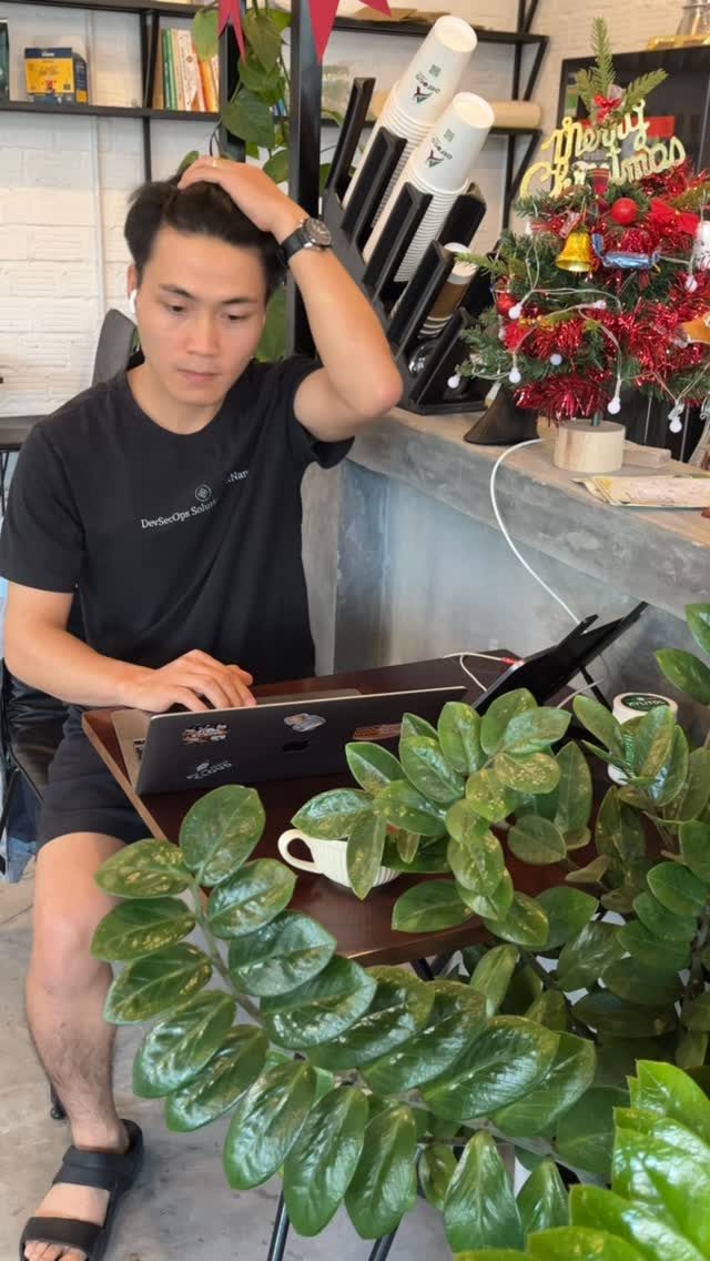 A laptop and a coffee on a wooden table